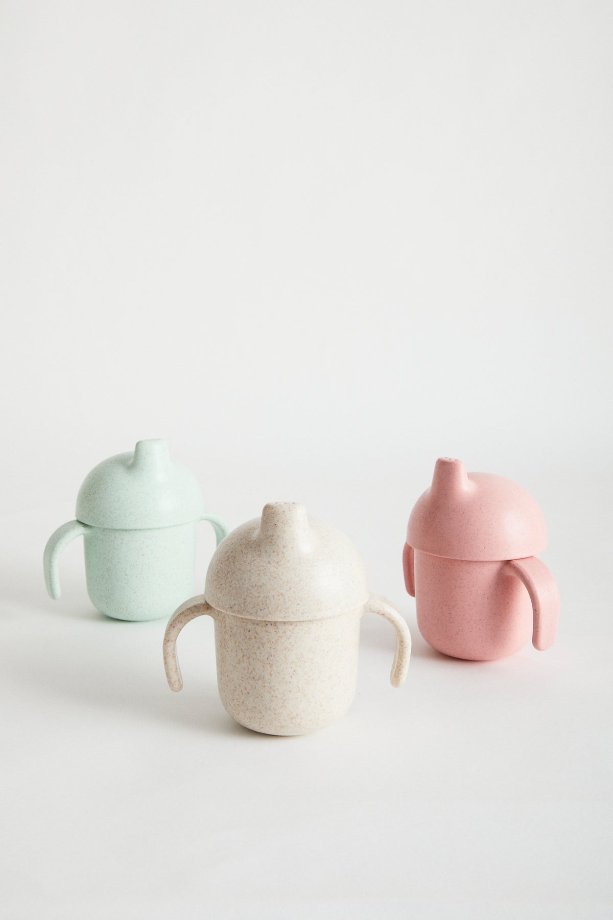 Wheat Straw Sippy Cup in Rose. White screw top lid, sappy spout and handles. Rose, Mint & Oat