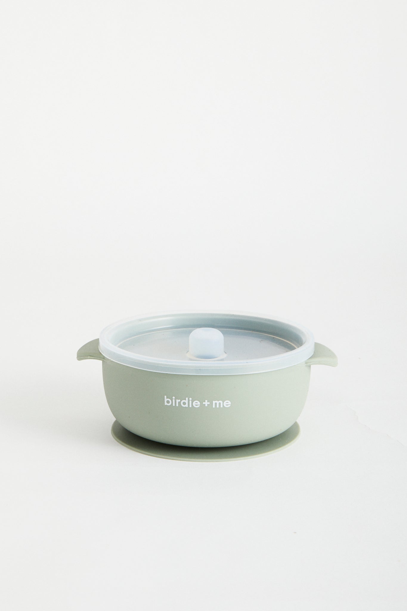 Silicone bowl with suction bottom and lid. Branded with birdie + me logo.