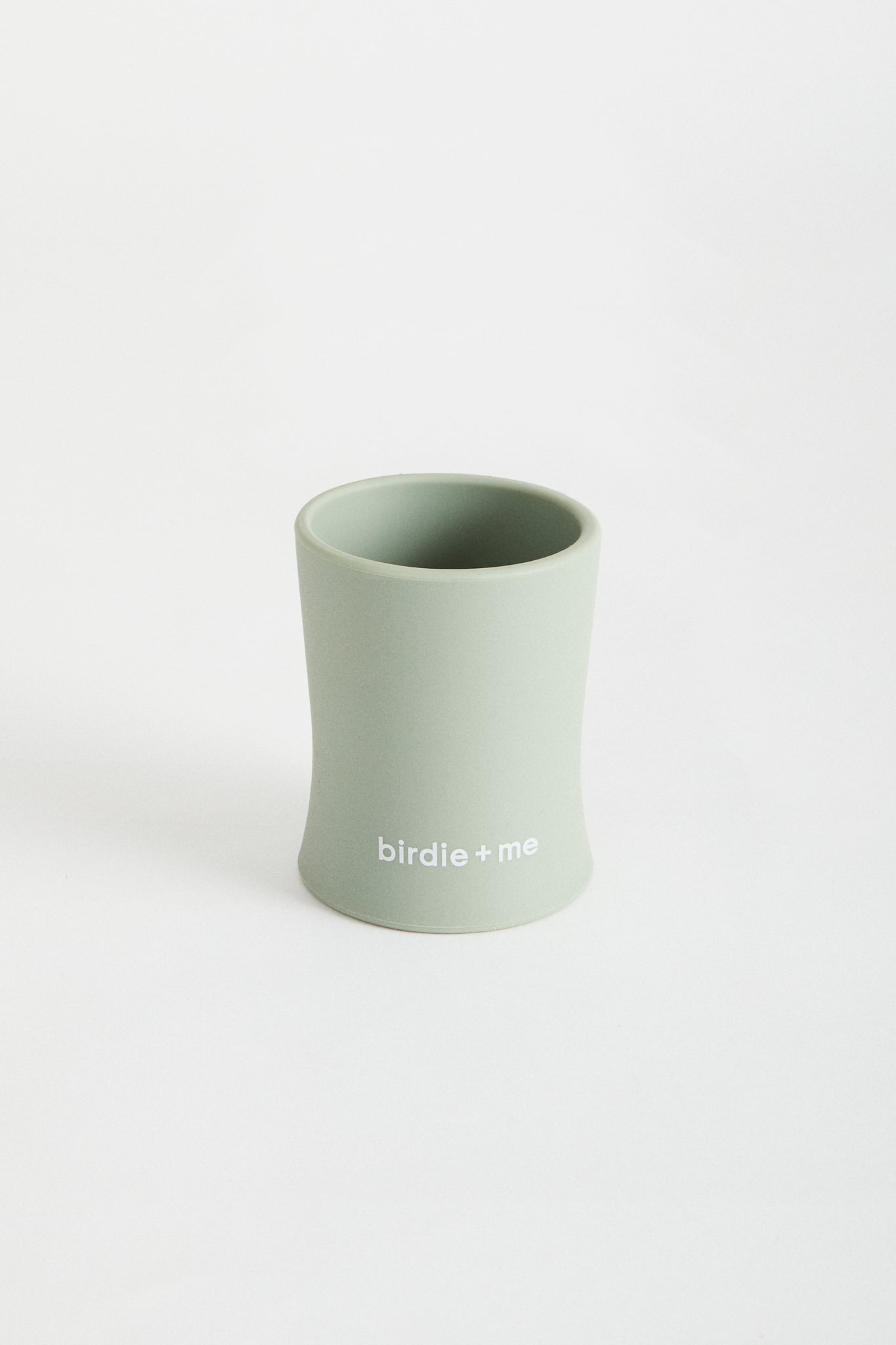 Silicone cup in Teal, birdie + me logo along bottom.