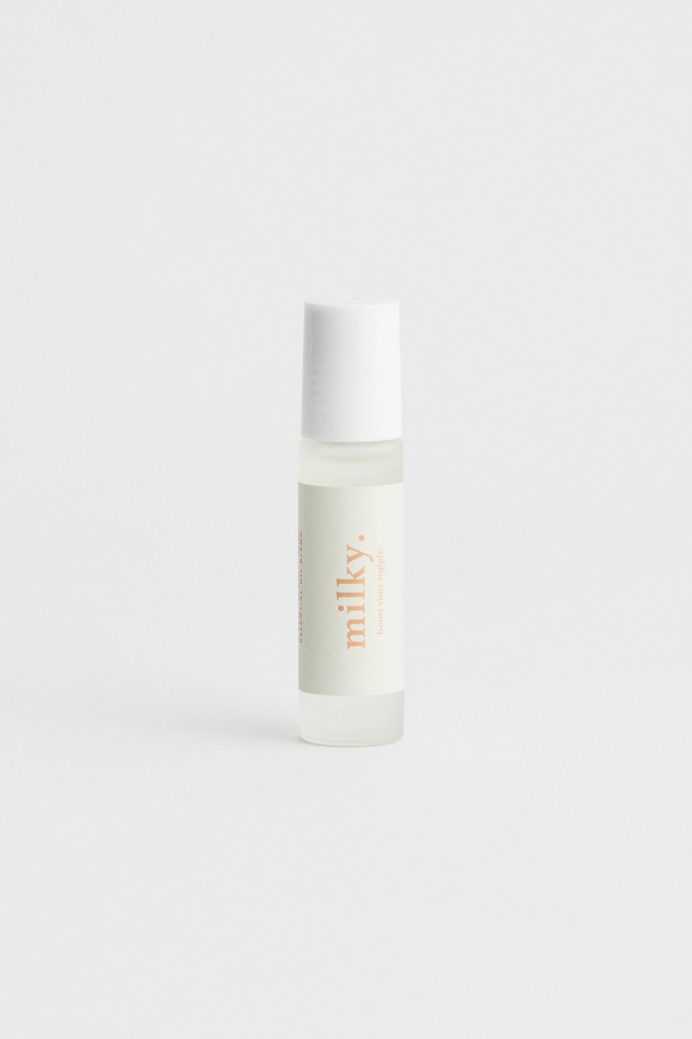 Clear bottle, white lid essential oil roller bottle. White branding with Milky text.
