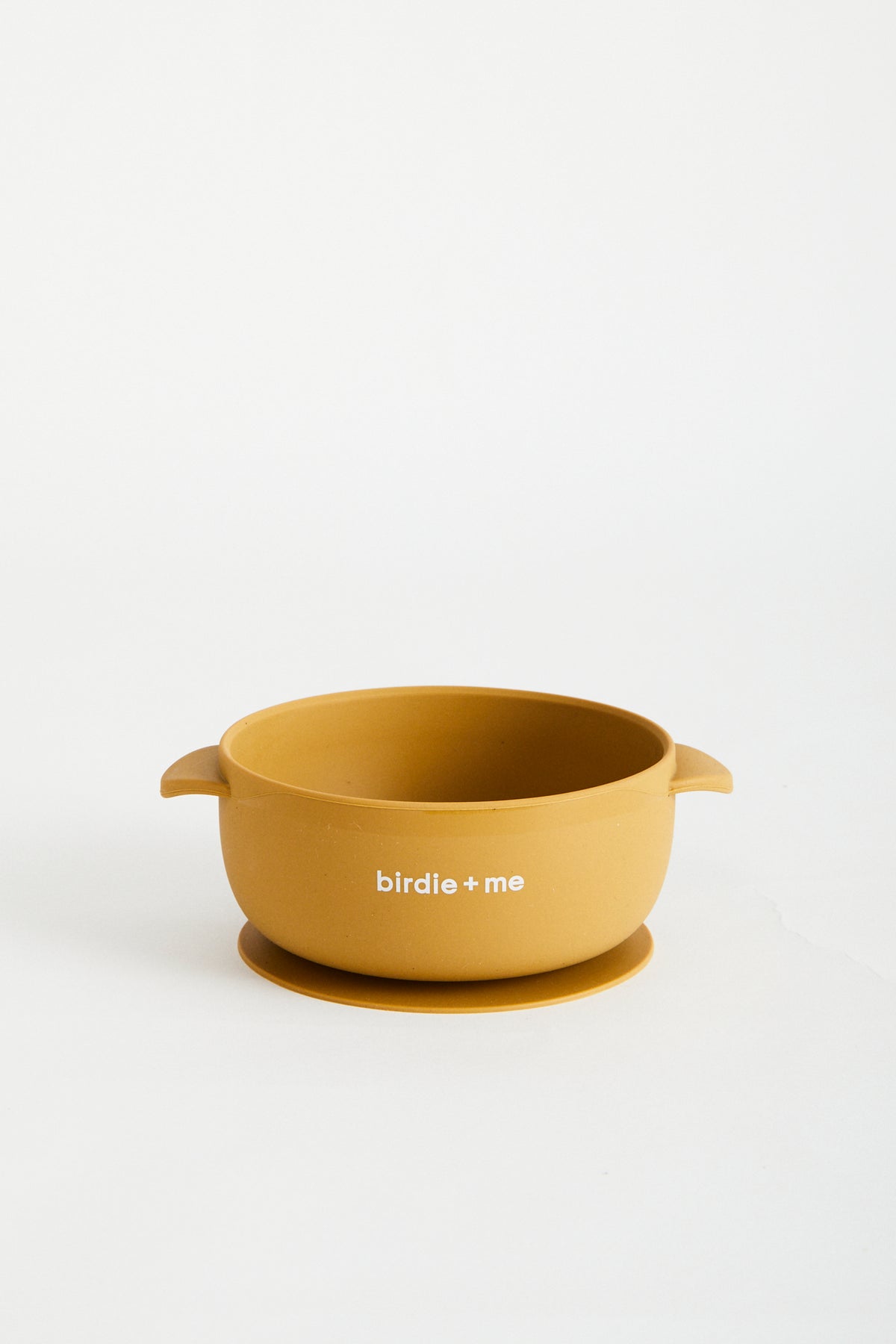 Silicone bowl with suction bottom and lid. Branded with birdie + me logo.