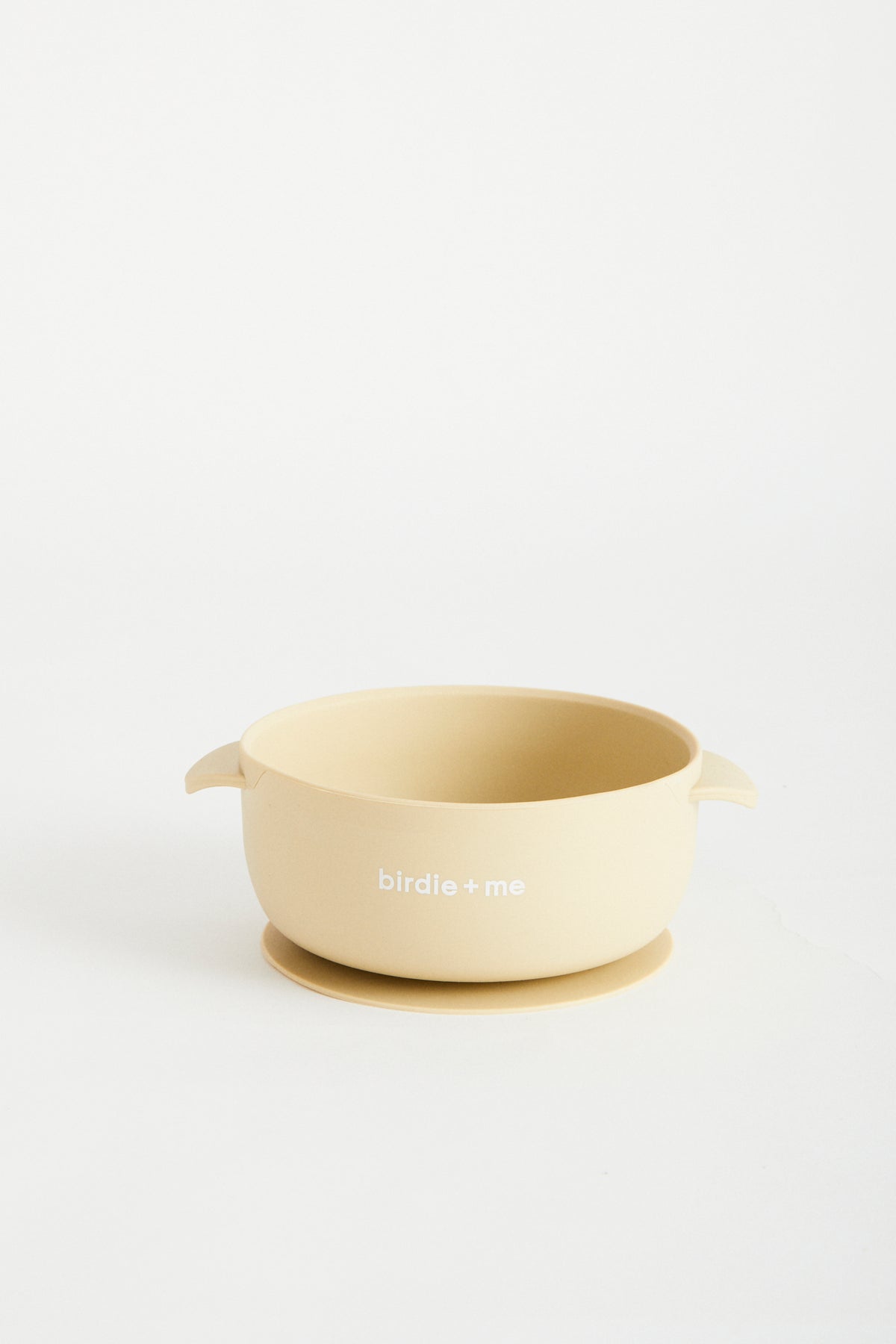 Silicone bowl with suction bottom and lid. Branded with birdie + me logo.
