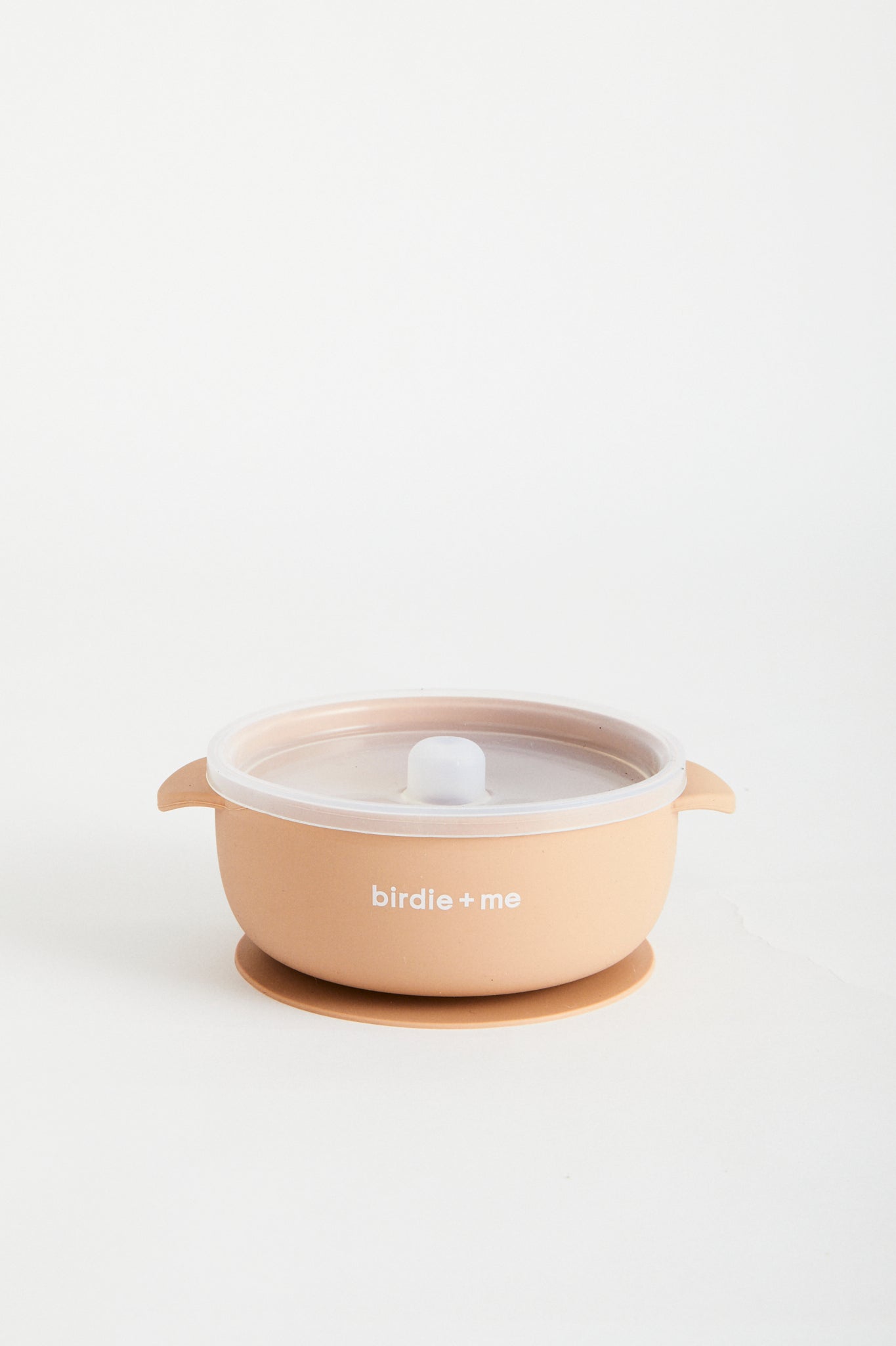 Silicone bowl with suction bottom and lid. Branded with birdie + me logo.