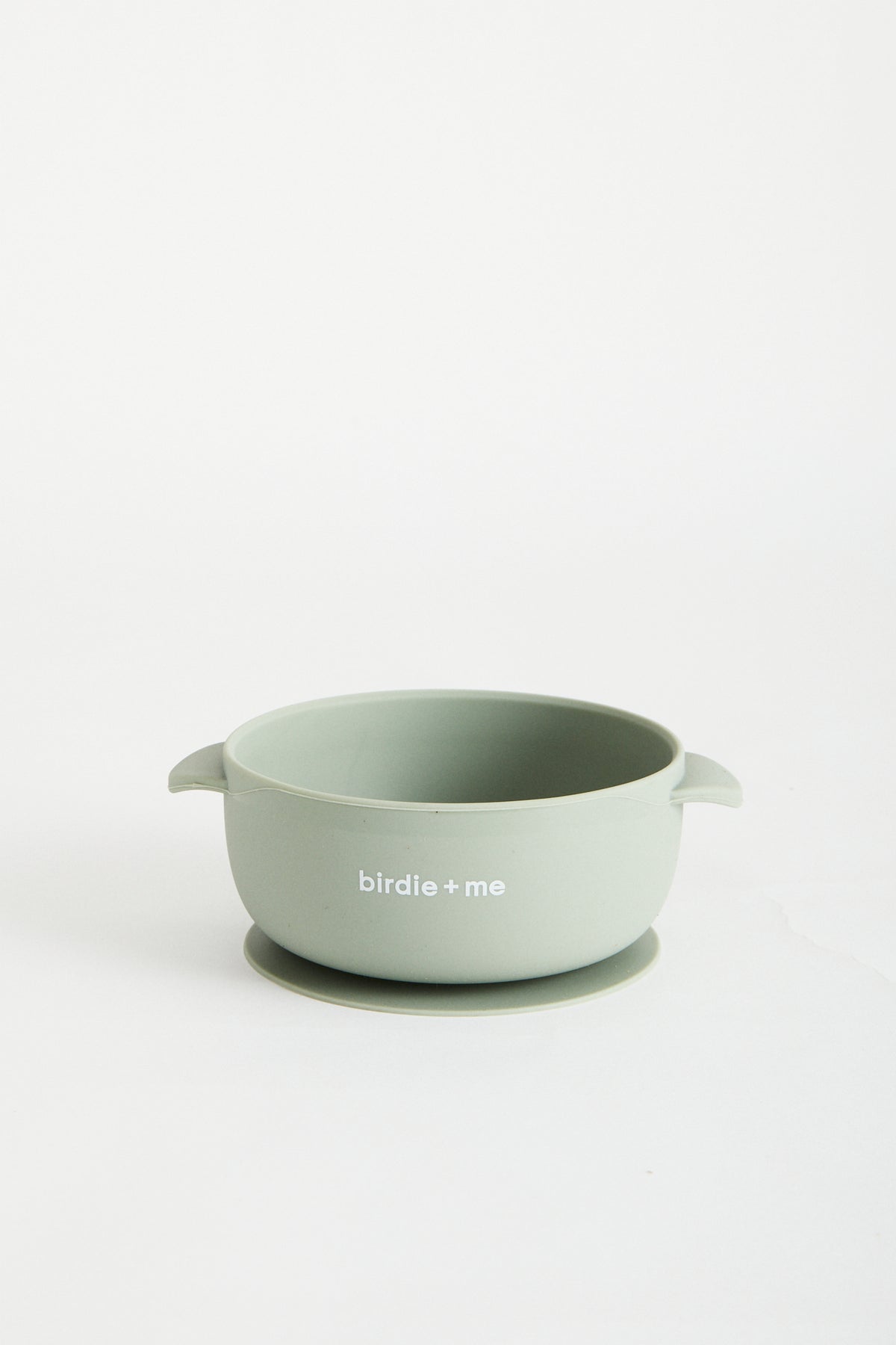 Silicone bowl with suction bottom and lid. Branded with birdie + me logo.