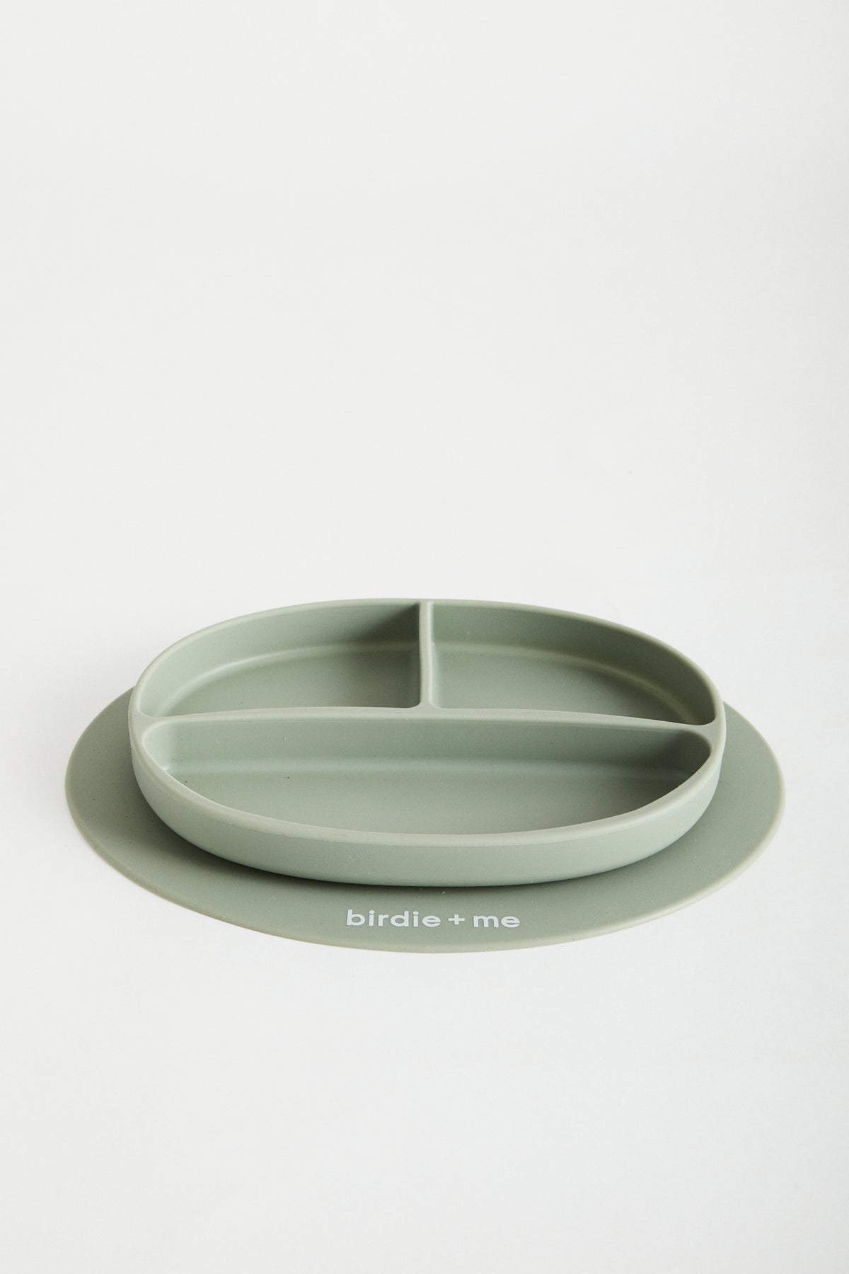 Silicone suction plate in teal. Featuring dividers and birdie + me logo.