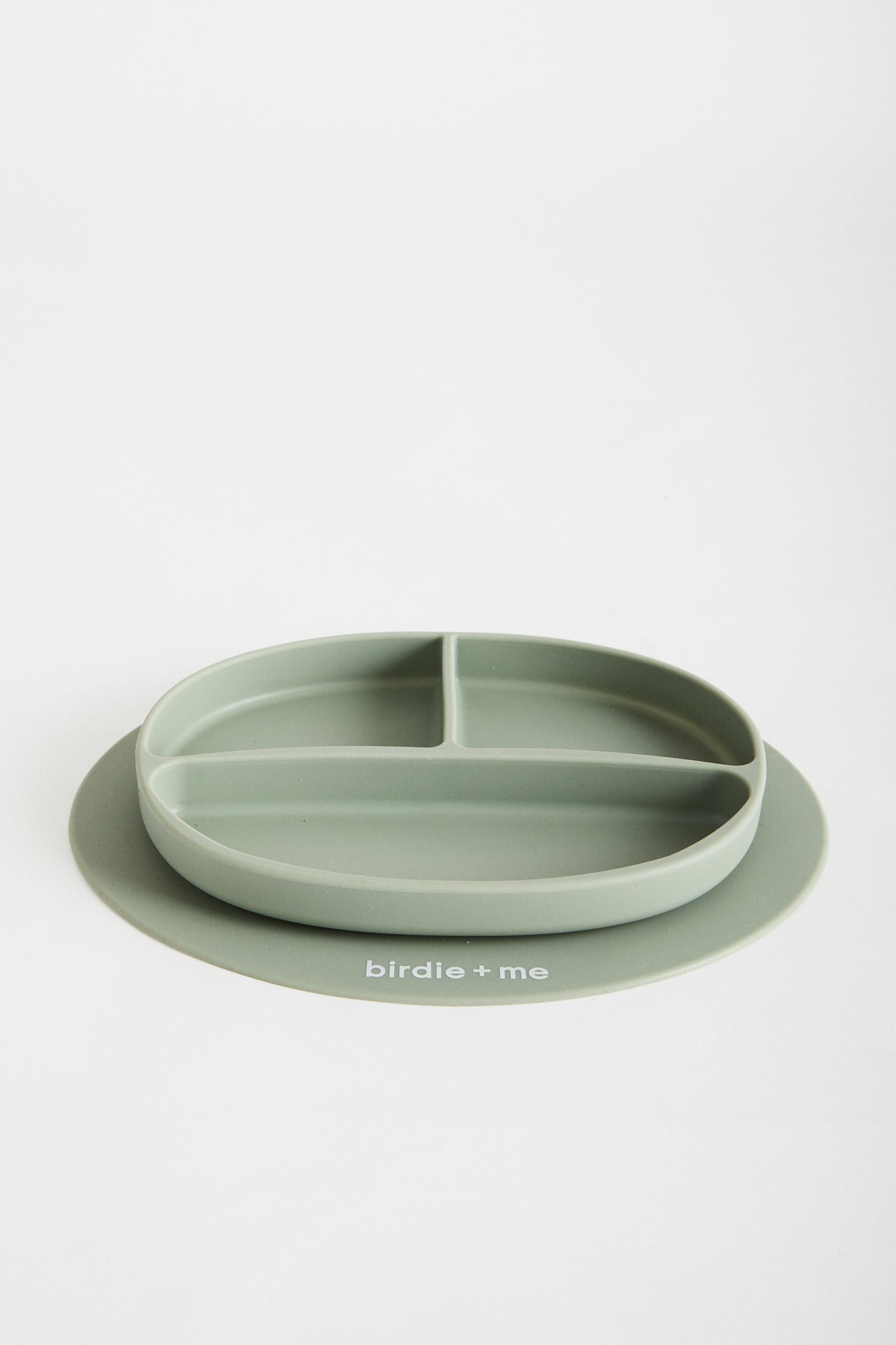 Silicone suction plate in teal. Featuring dividers and birdie + me logo.
