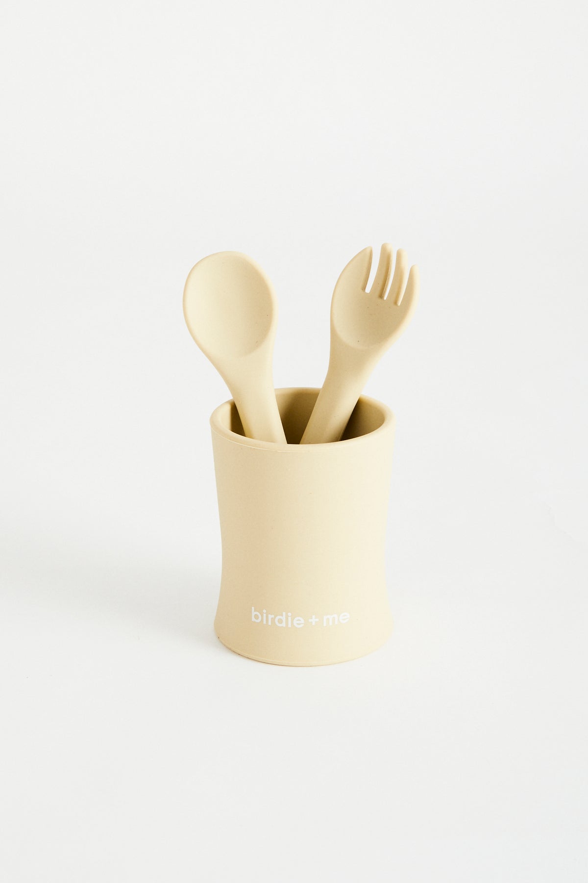 Silicone cup in Honey, birdie + me logo along bottom. Teamed with silicone cutlery set in Honey.