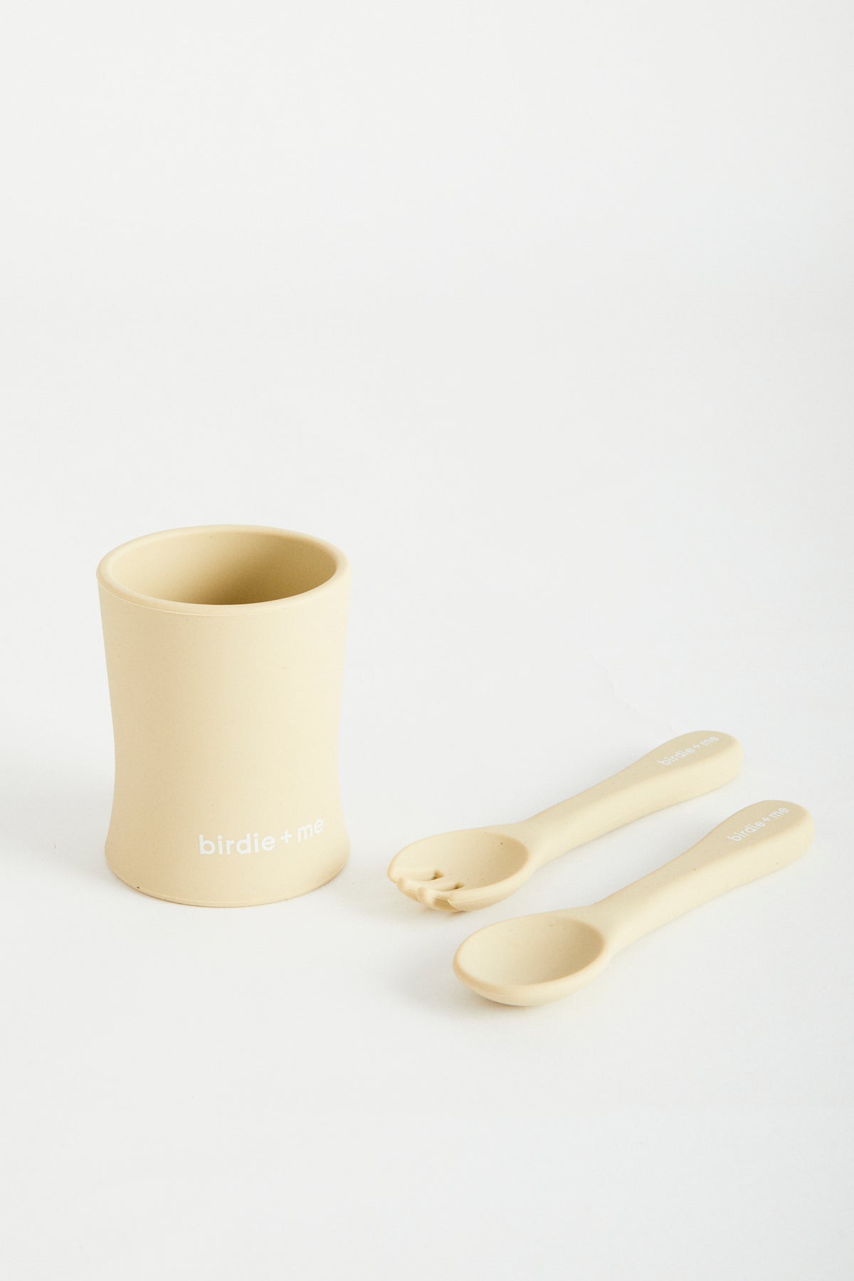 Silicone cup in Honey, birdie + me logo along bottom. Teamed with silicone cutlery set in Honey.