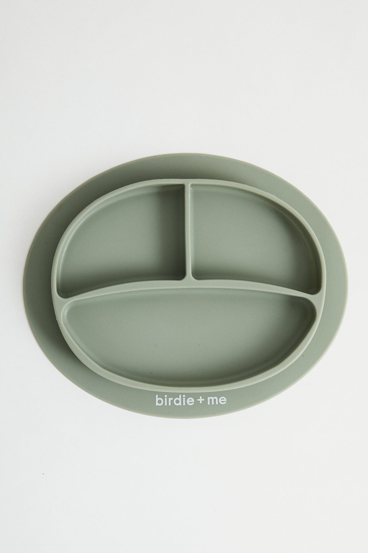 Silicone suction plate in teal. Featuring dividers and birdie + me logo.