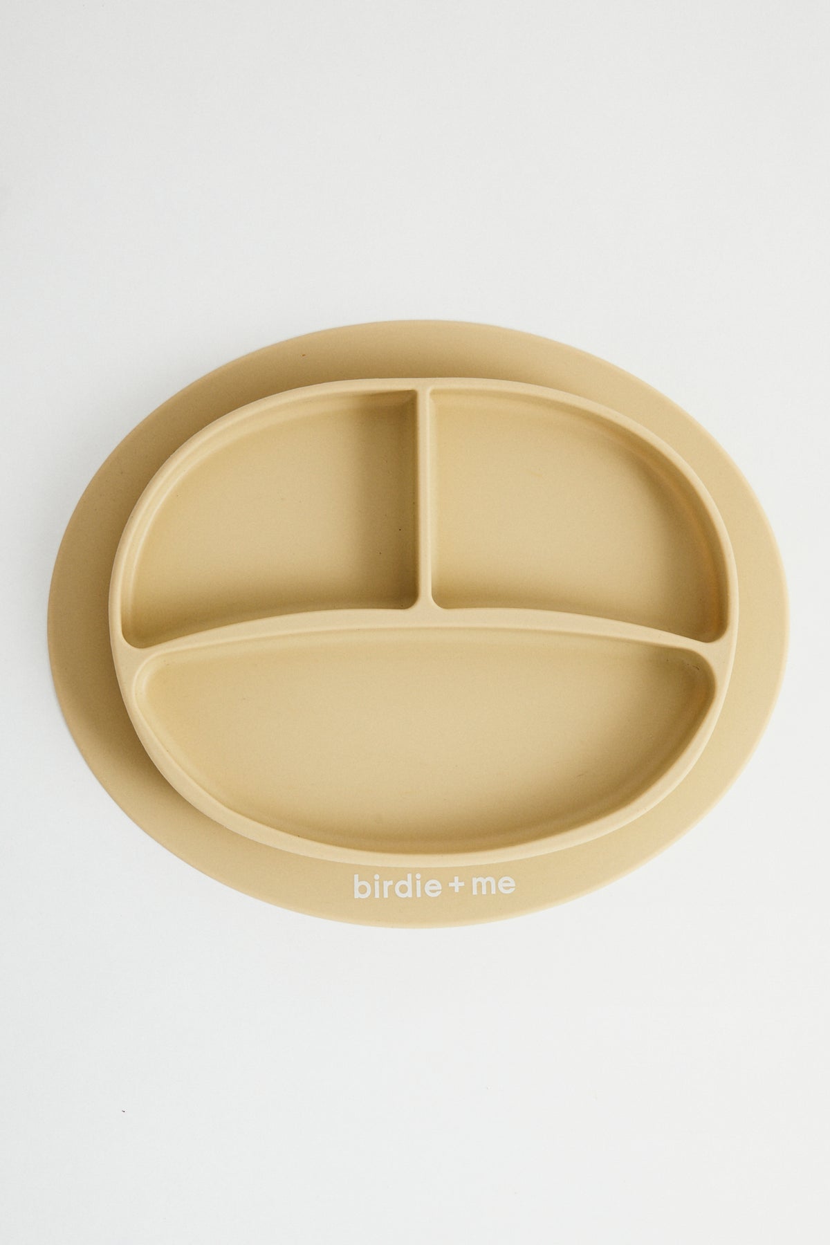 Silicone suction plate in honey. Featuring dividers and birdie + me logo.