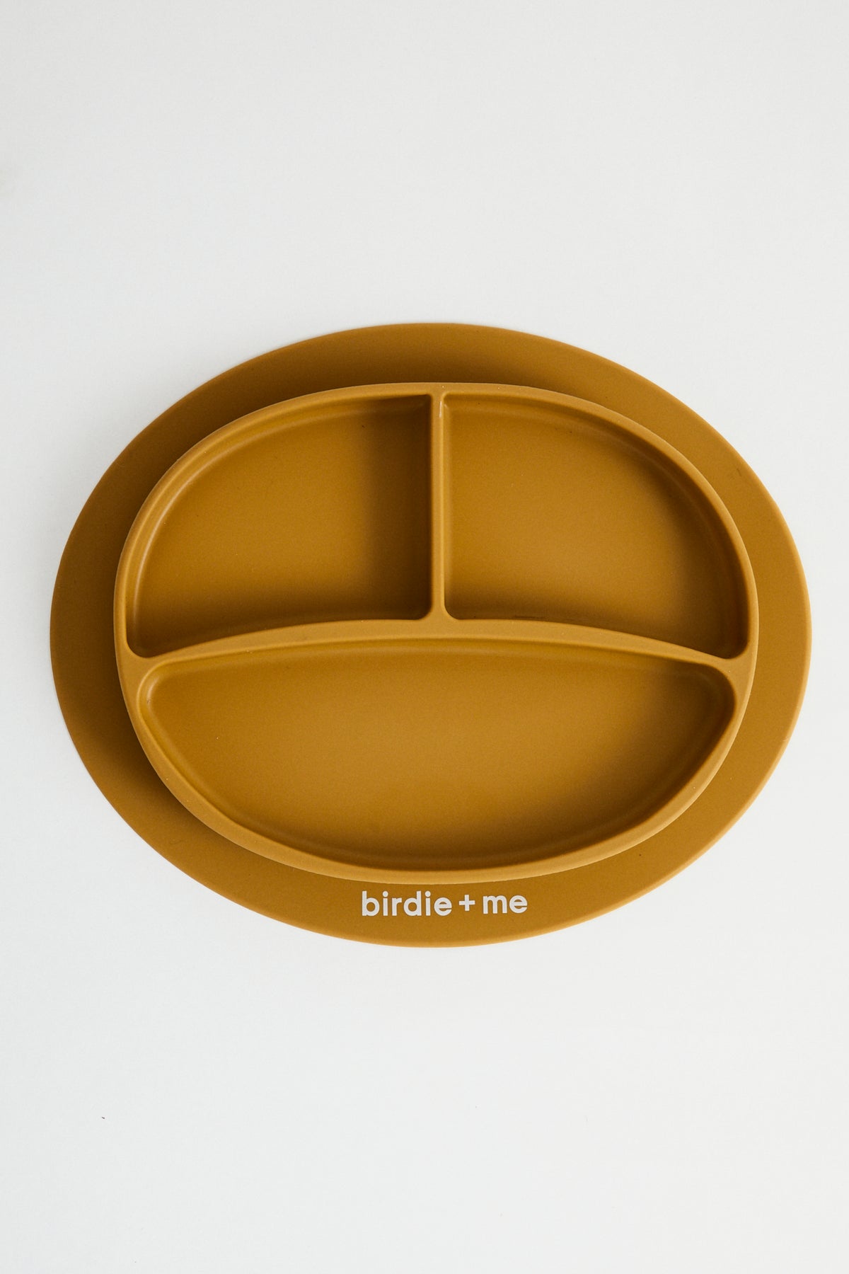 Silicone suction plate in clay. Featuring dividers and birdie + me logo.
