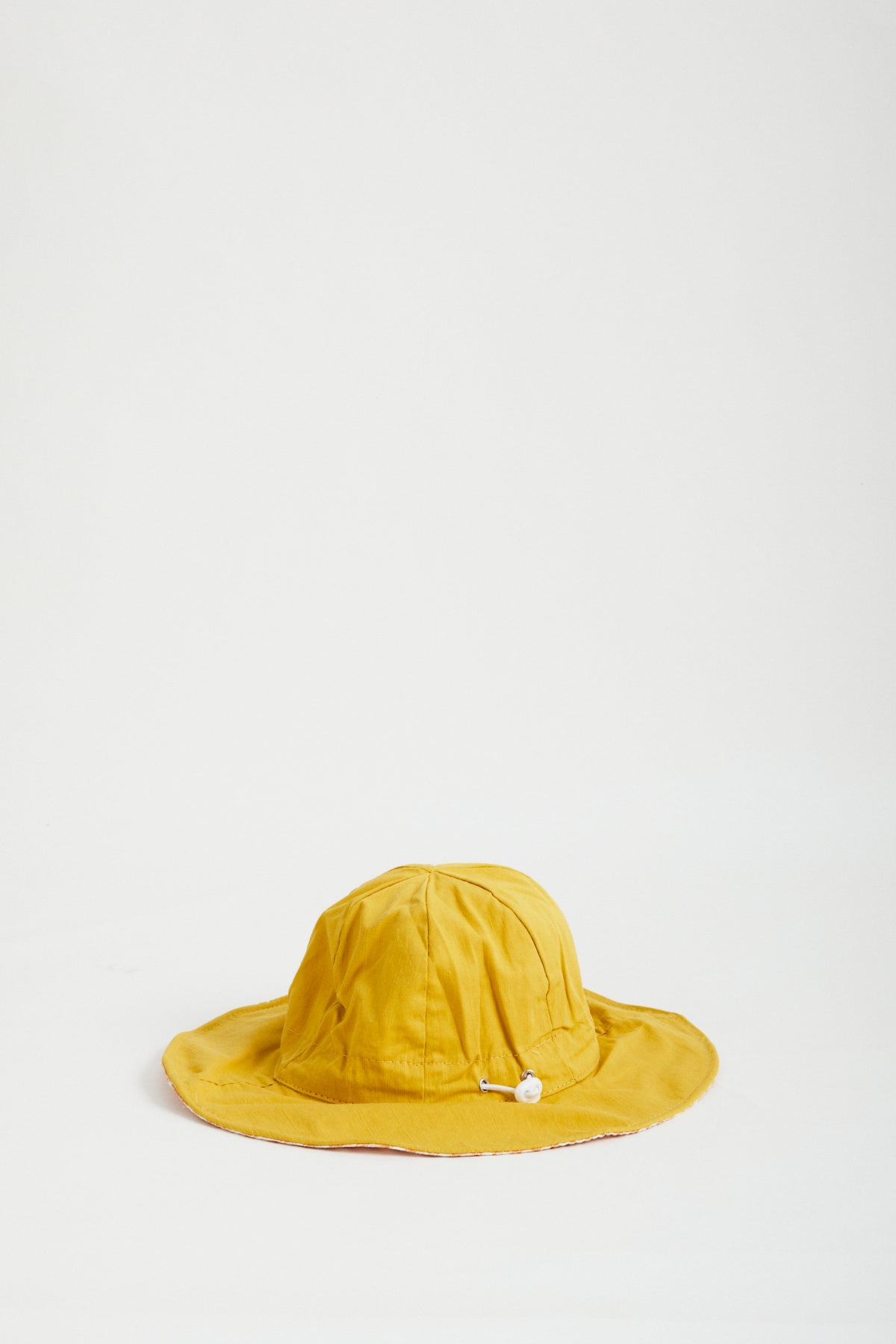 Sunshine Gingham reversible sun hat. Drawstring toggle and wire brim.