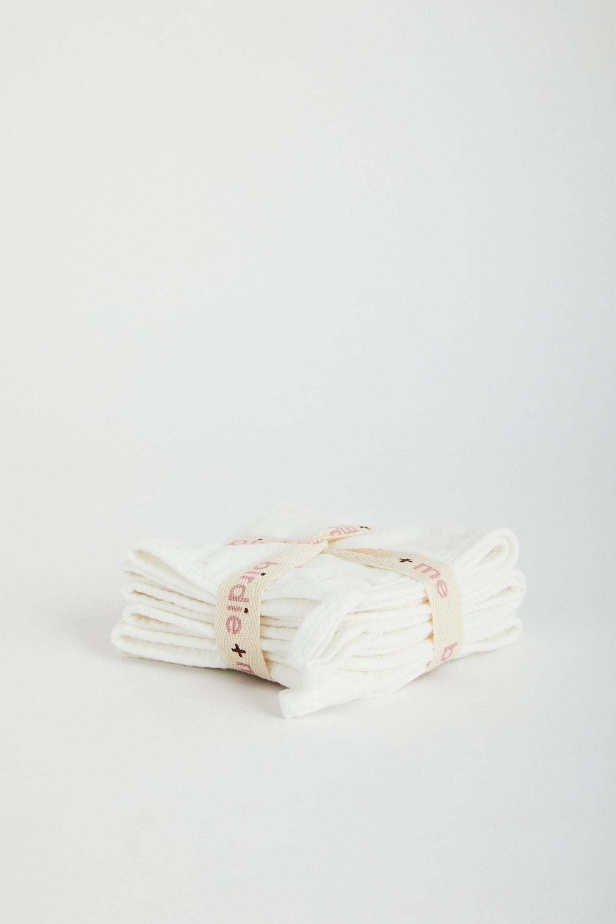 Organic muslin wash cloths in white. Set of three, wrapped in Birdie + Me branded cotton ribbon.