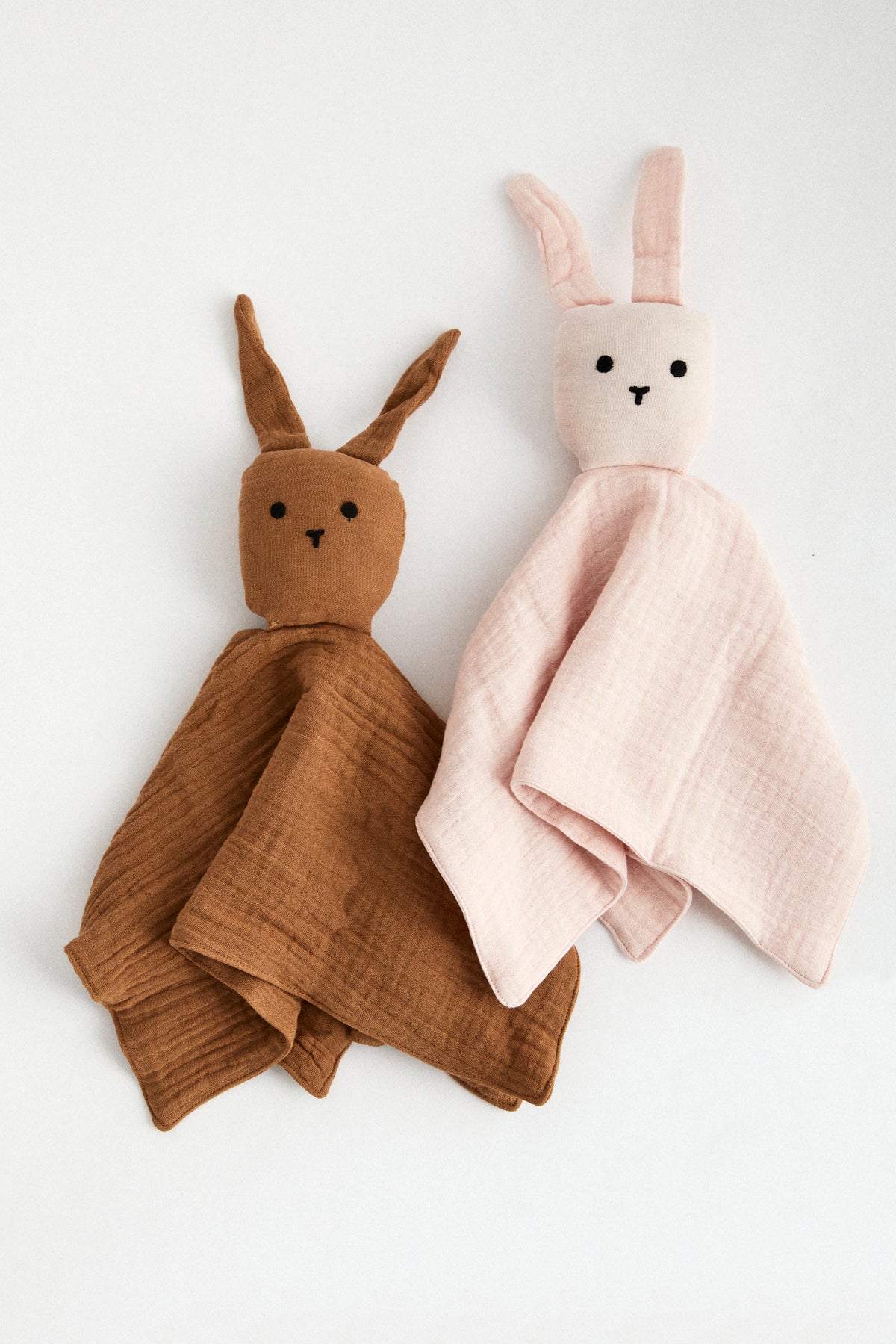 Chocolate organic muslin lovey with bunny head and floppy ears.