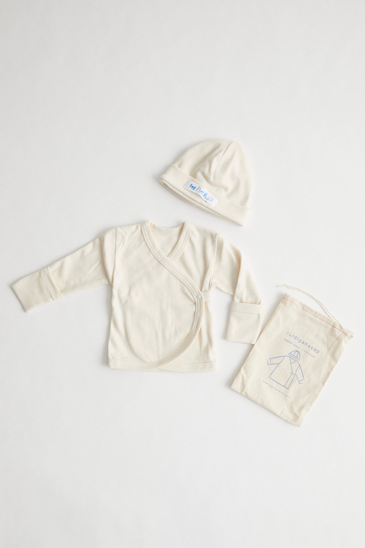 organic cotton baby kimono and beanie packaged in muslin drawstring pouch.
