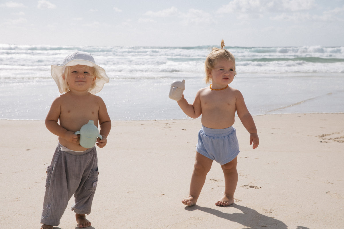 Wheat Straw Sippy Cup in Oat. White screw top lid, sappy spout and handles.