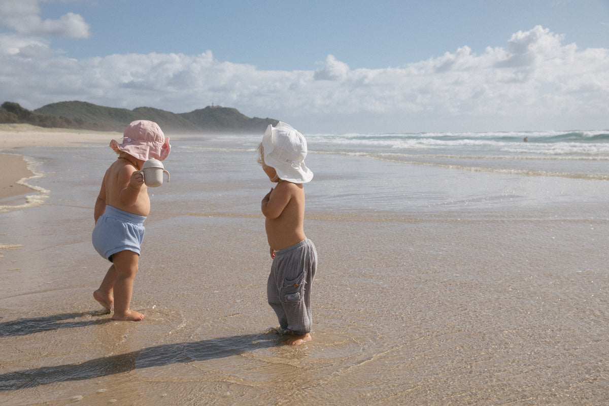 Sunshine Gingham reversible sun hat. Drawstring toggle and wire brim.