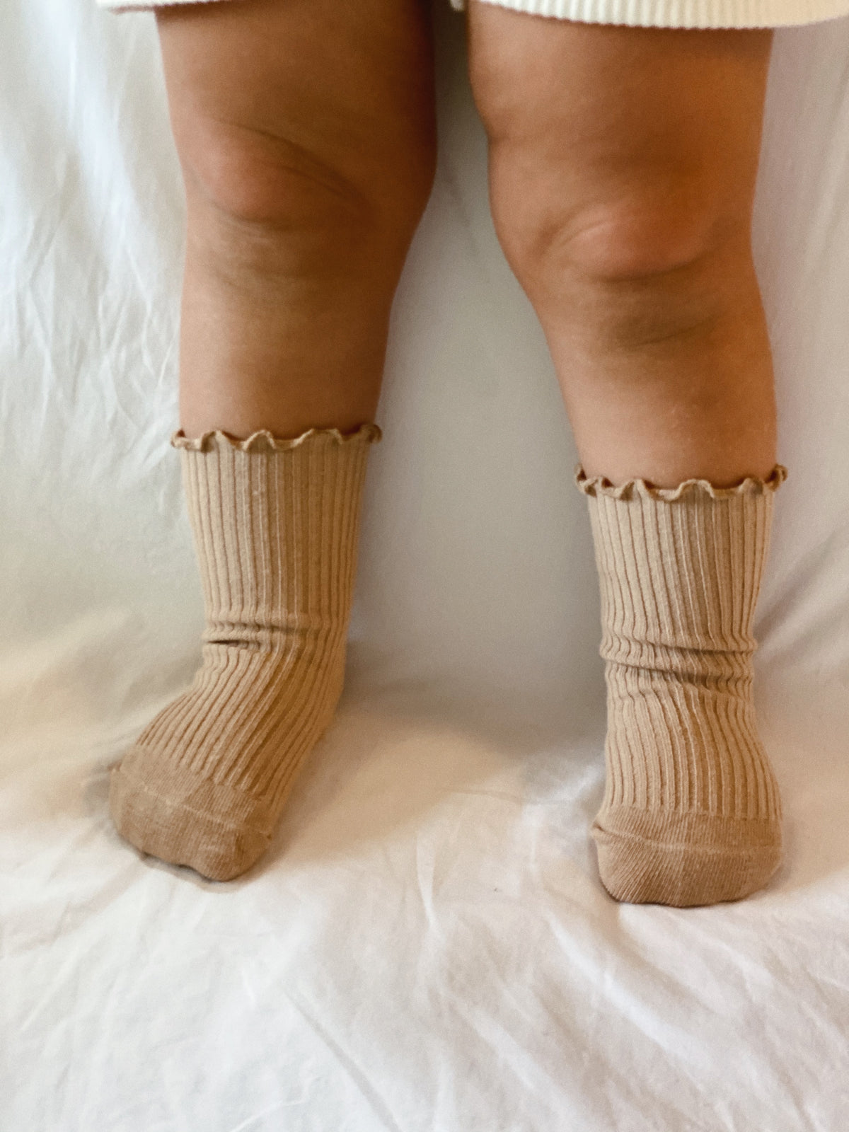 Ruffle and ribbed Socks in Sand, worn high.
