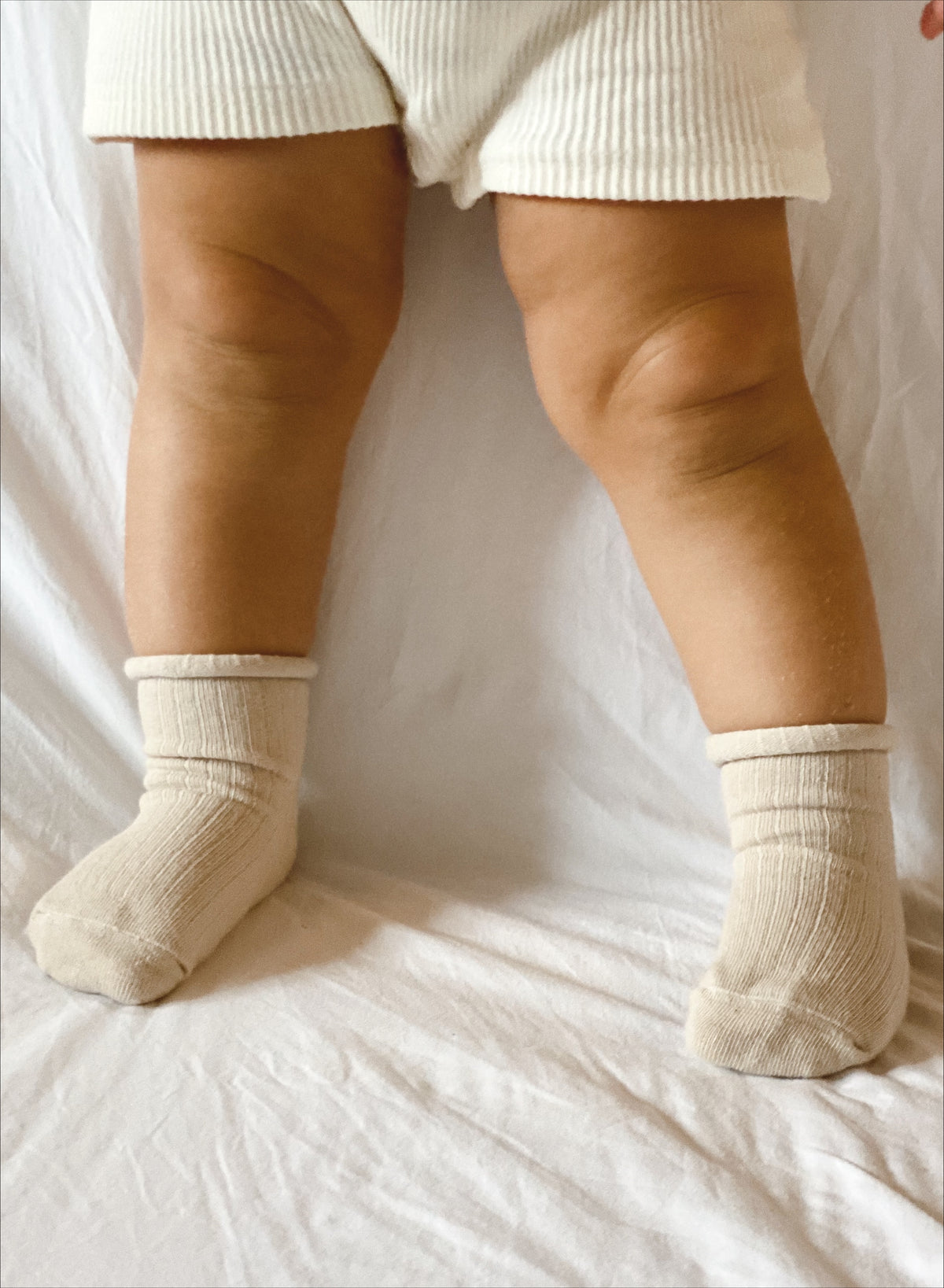 Oat coloured ribbed socks, rolled hem.